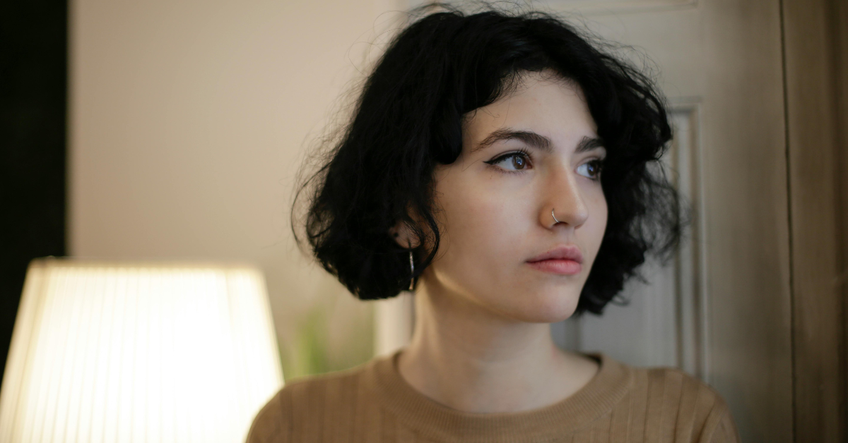 A woman who is thinking about seeking treatment for trauma and addiction