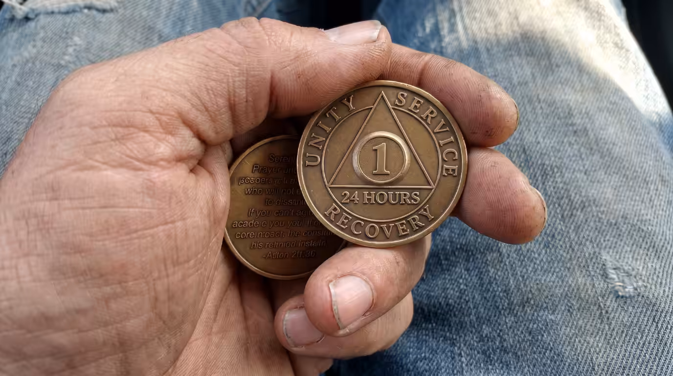 A man in Ohio holding a 24 hour AA chip. Casey’s Law Can You Force Someone Into Rehab.
